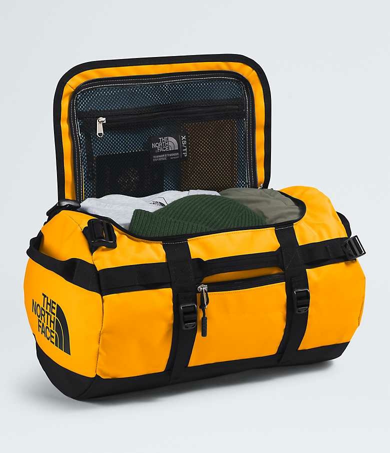 The North Face Base Camp Duffel XS - Borsone da Viaggio Impermeabile 31 L in Nylon e Poliestere, Colore Summit Gold/TNF Black