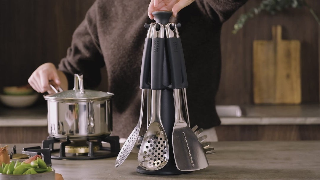 Joseph Joseph Elevate Carousel Set - Utensili in Acciaio Inox con Manici Ponderati e Poggiautensili Integrati